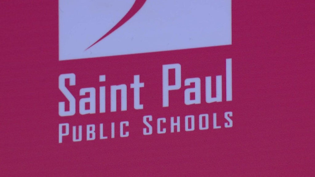 St. Paul Public Schools building with diverse students entering, symbolizing community education.