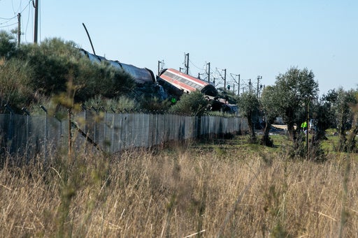 High-speed train collision wreckage in Urda, Spain, with rescue workers